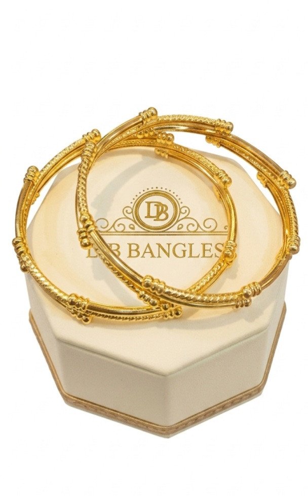 These are gold-toned bangles, specifically identified as "DB BANGLES".