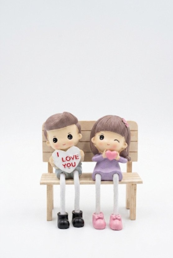 Romantic Couple Figurine on Bench